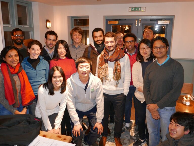 Members of the Rao Group at an indoor gathering, 2018
