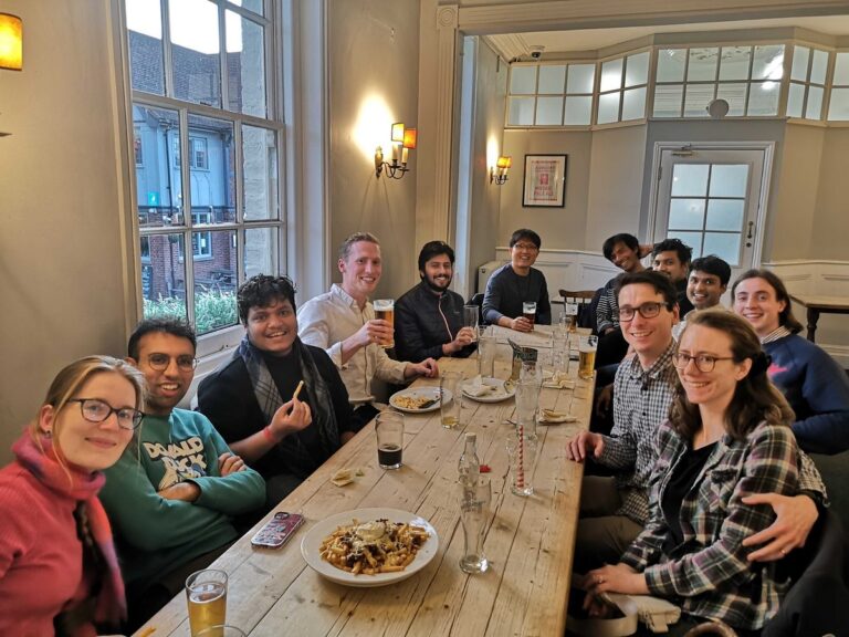 Members of the Rao Group at dinner, 2023